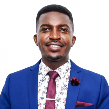 Amiel Nubaha was born in a refugee camp in Tanzania, after his family had fled the Rwandan genocide in 1994. Young black male with bright blue suit jacket, plum tie and pocket square, and white collared shirt with faint floral pattern smiles at camera